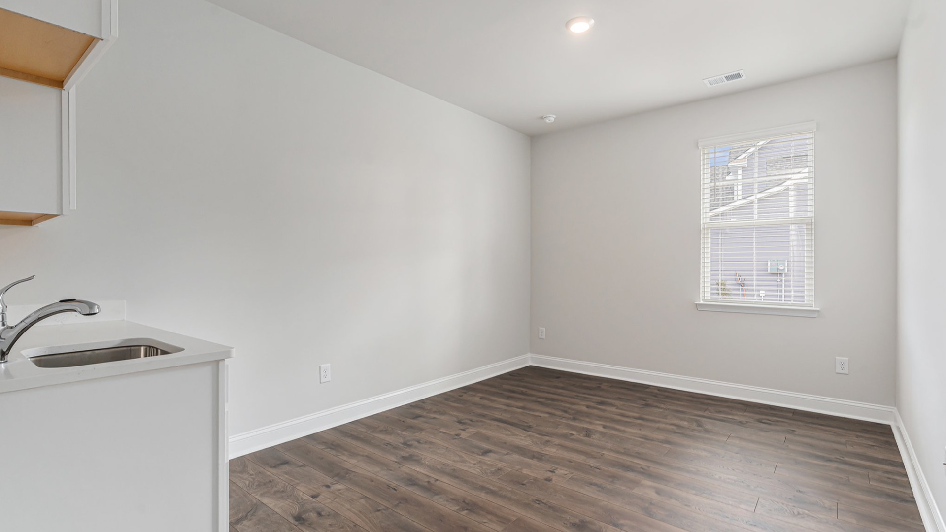Four additional bedrooms and two full baths ensure plenty of space for family, guests, or a home office.