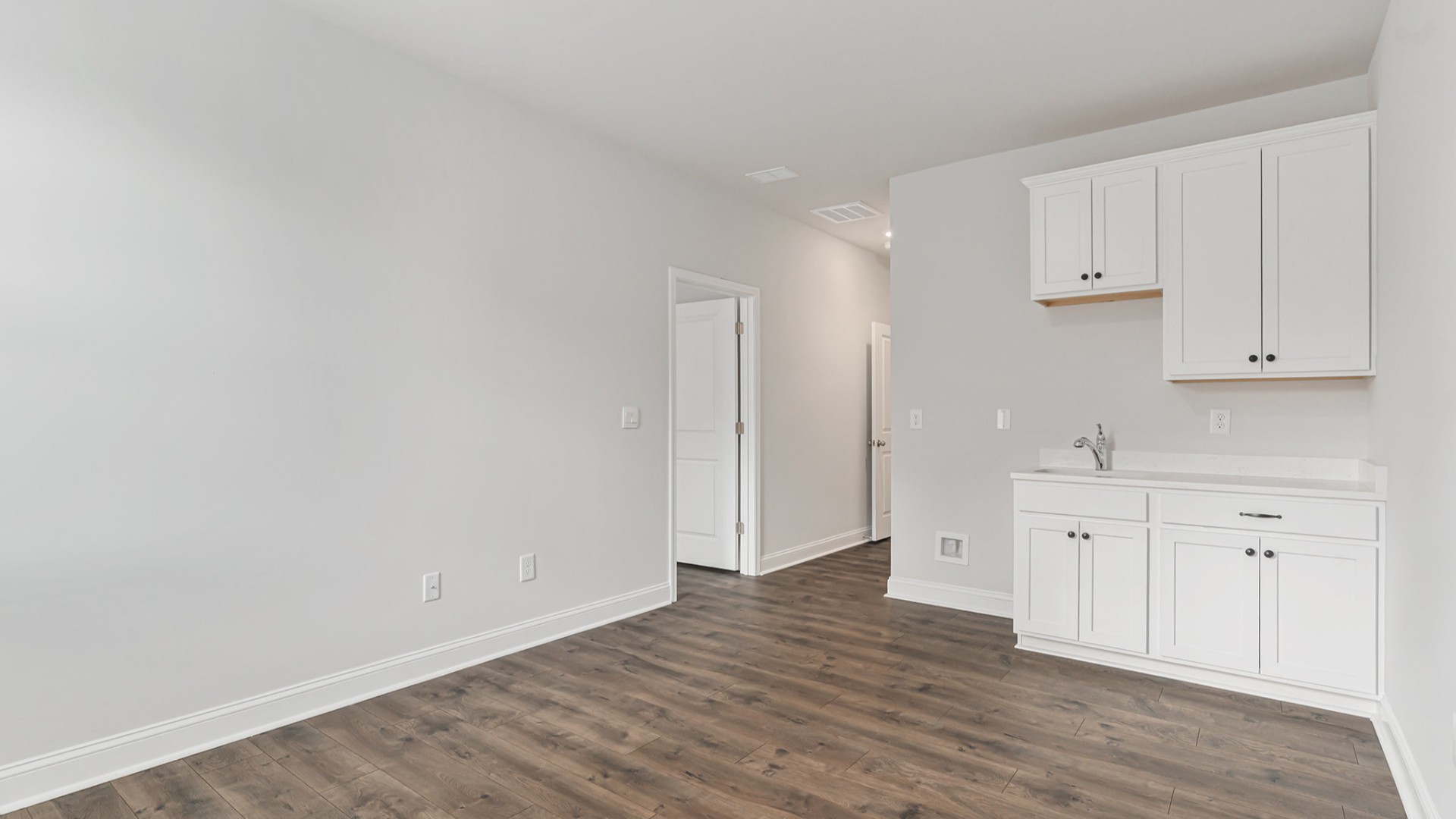 Four additional bedrooms and two full baths ensure plenty of space for family, guests, or a home office.