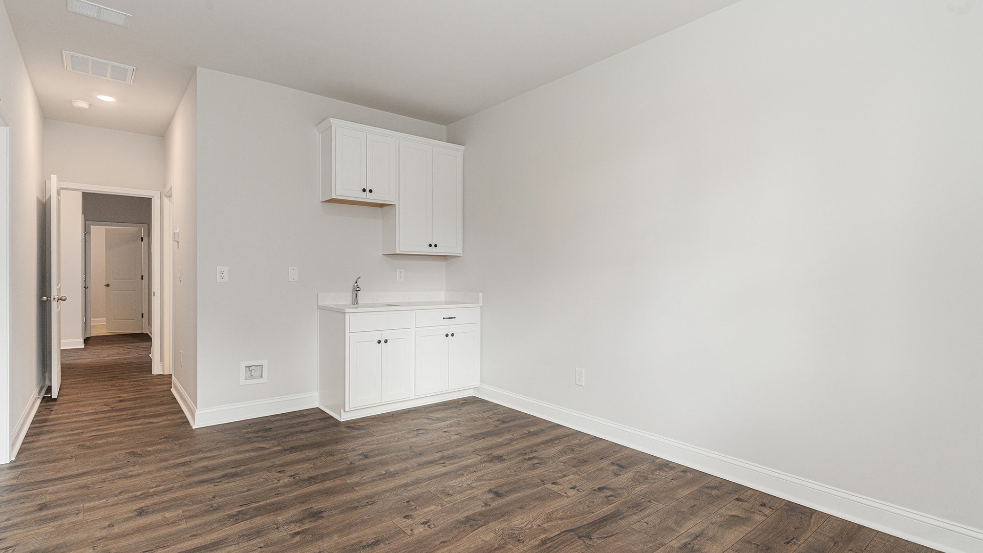 Four additional bedrooms and two full baths ensure plenty of space for family, guests, or a home office.