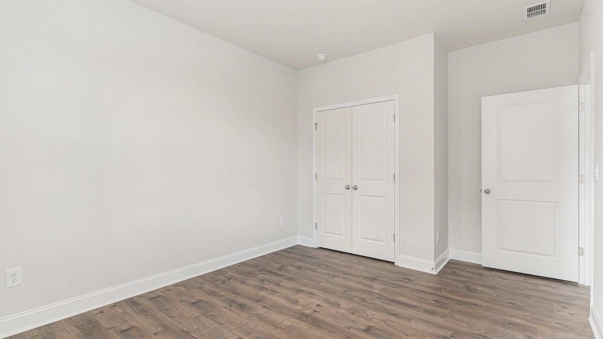 Four additional bedrooms and two full baths ensure plenty of space for family, guests, or a home office.