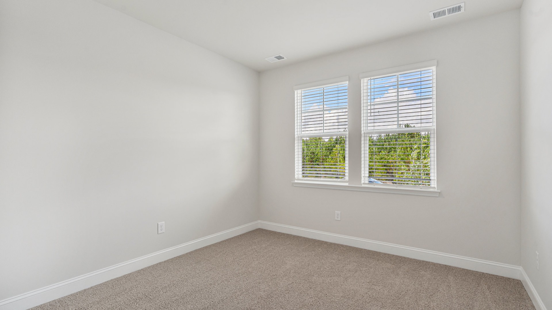 Four additional bedrooms and two full baths ensure plenty of space for family, guests, or a home office.