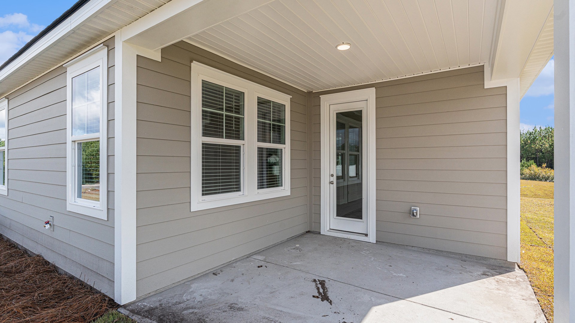 Enjoy seamless indoor-outdoor living with a covered porch perfect for entertaining or relaxing, plus a spacious 3-car garage that offers ample storage.