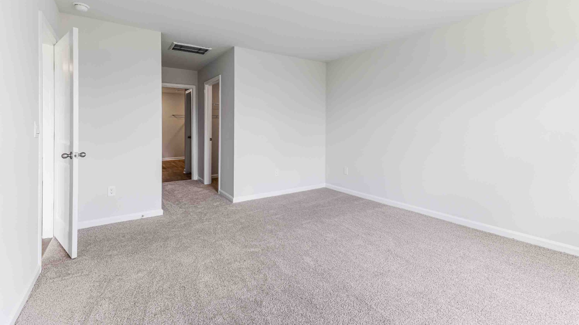 The Primary Suite offers a massive closet and a luxurious bathroom with a walk-in shower, linen closet, and dual vanity