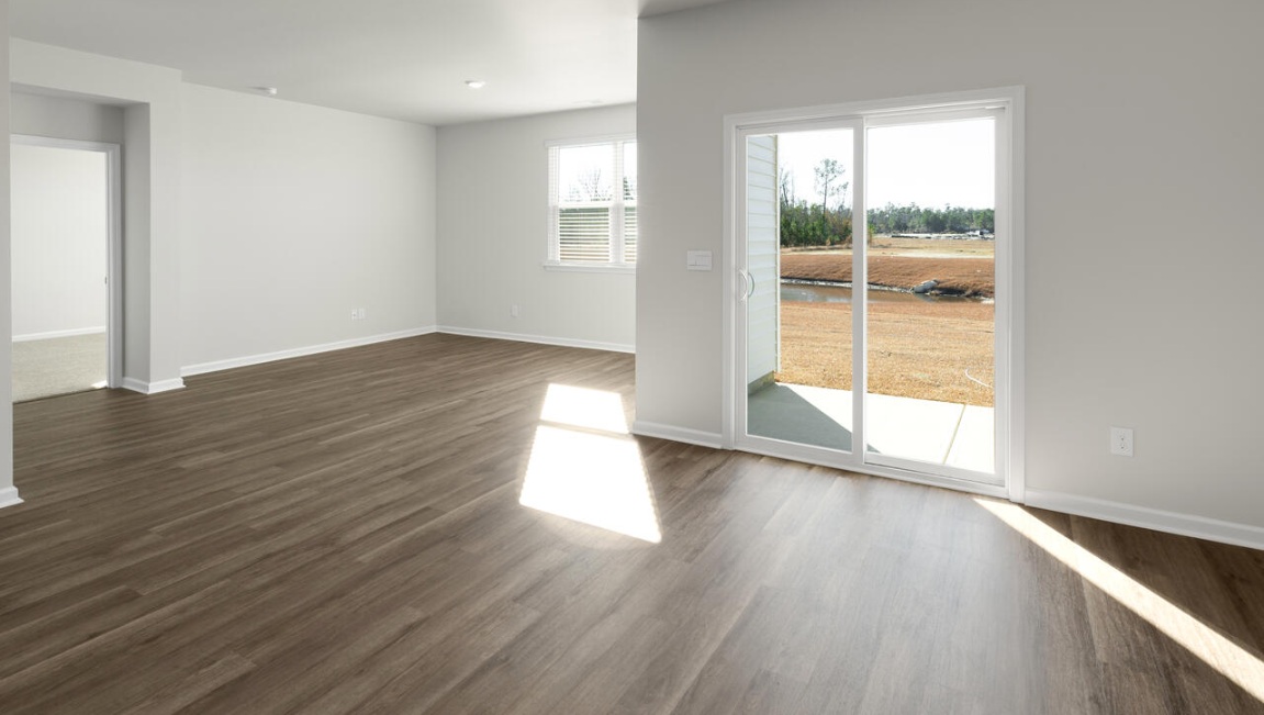 The kitchen features beautiful cabinets, granite countertops, and stainless steel appliances, which are sure to both turn heads and make meal prep easy.