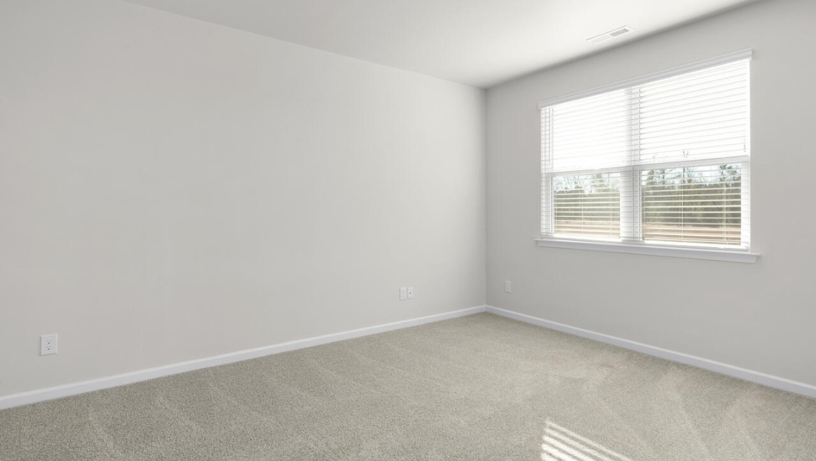 The primary bedroom has its own attached bathroom that features a walk-in closet and all the space you need to get ready in the morning.