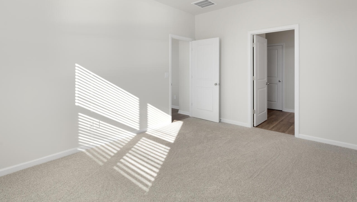 The primary bedroom has its own attached bathroom that features a walk-in closet and all the space you need to get ready in the morning.