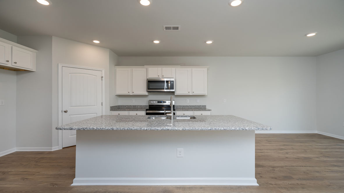 The Elle is a 2,721 sq ft home featuring 5 Bedrooms and 3.5 Baths. Its open-concept design includes a kitchen with Granite countertops, Stainless Steel Appliances, an island, and a walk-in pantry, while the large Great Room is ideal for entertaining.