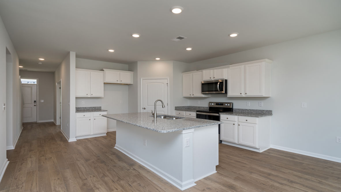 The Elle is a 2,721 sq ft home featuring 5 Bedrooms and 3.5 Baths. Its open-concept design includes a kitchen with Granite countertops, Stainless Steel Appliances, an island, and a walk-in pantry, while the large Great Room is ideal for entertaining.