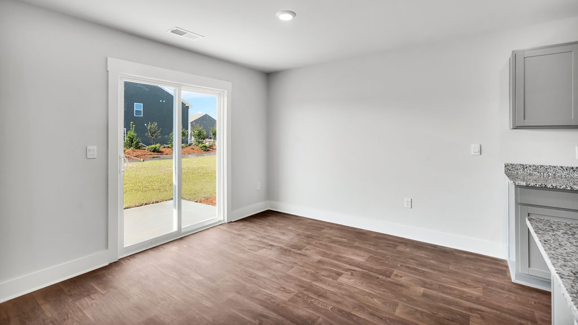 Its open-concept design includes a kitchen with Granite countertops, Stainless Steel Appliances, an island, and a walk-in pantry, while the large Great Room is ideal for entertaining.