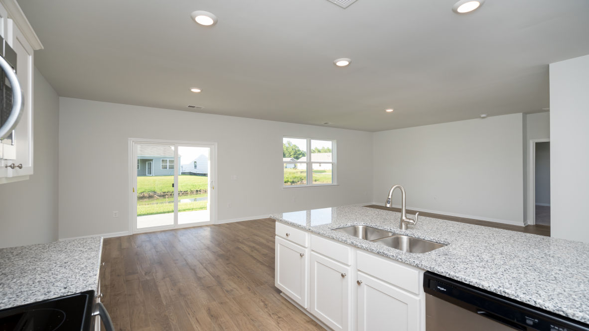 . Its open-concept design includes a kitchen with Granite countertops, Stainless Steel Appliances, an island, and a walk-in pantry, while the large Great Room is ideal for entertaining.