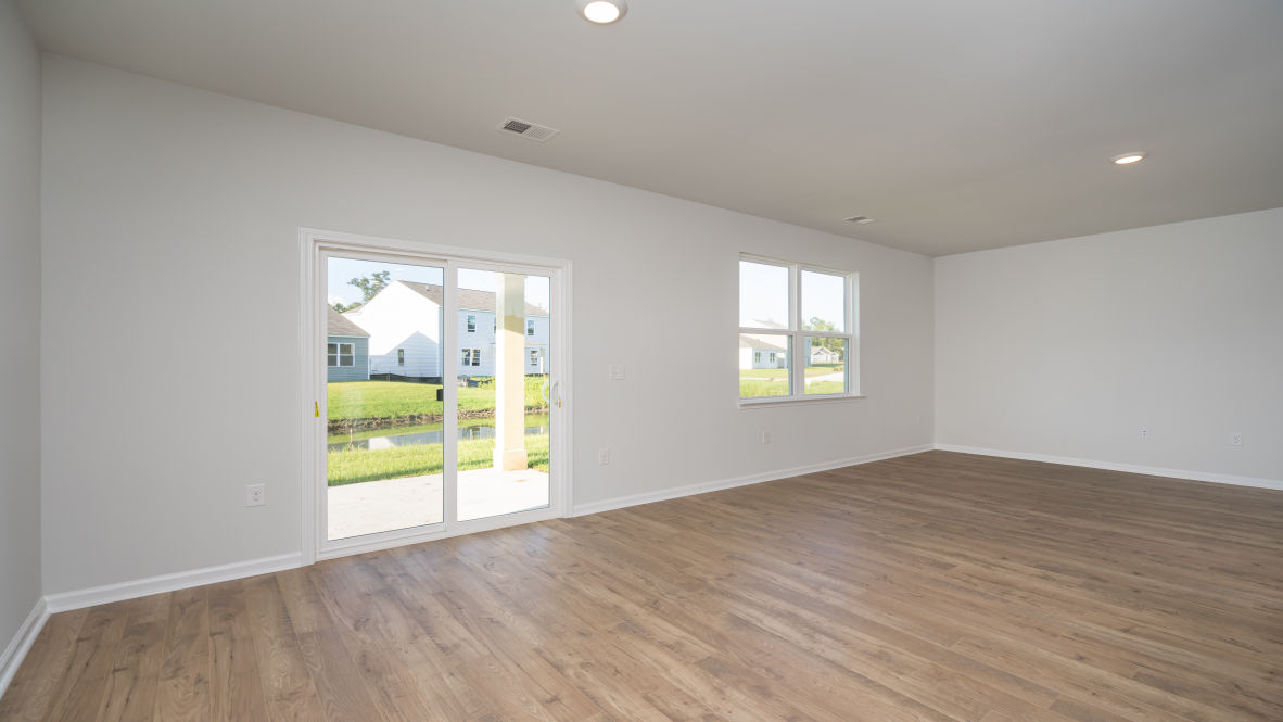 . Its open-concept design includes a kitchen with Granite countertops, Stainless Steel Appliances, an island, and a walk-in pantry, while the large Great Room is ideal for entertaining.