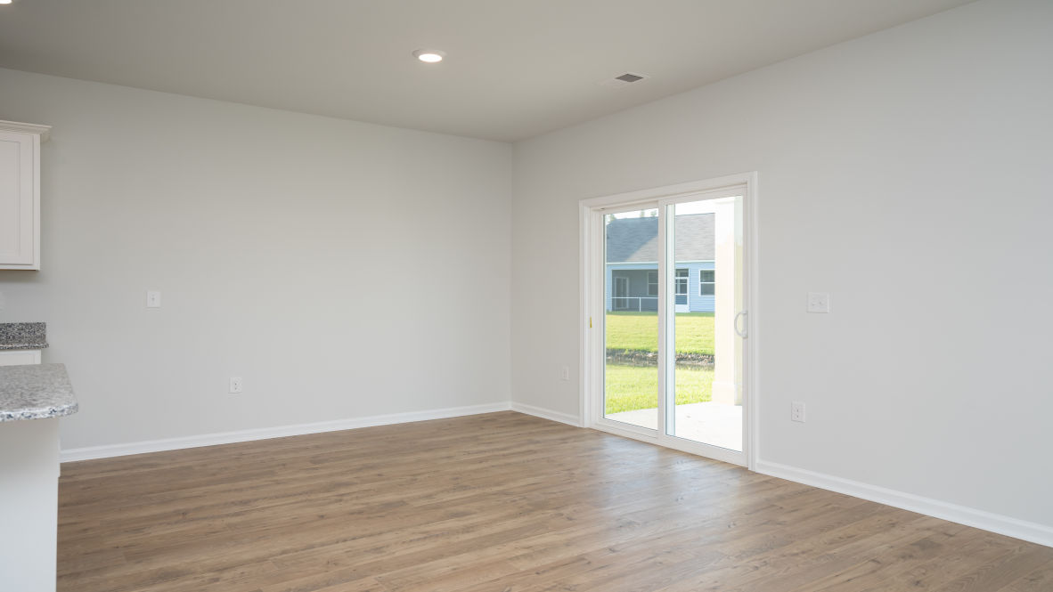. Its open-concept design includes a kitchen with Granite countertops, Stainless Steel Appliances, an island, and a walk-in pantry, while the large Great Room is ideal for entertaining.