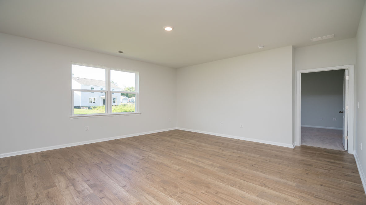 . Its open-concept design includes a kitchen with Granite countertops, Stainless Steel Appliances, an island, and a walk-in pantry, while the large Great Room is ideal for entertaining.
