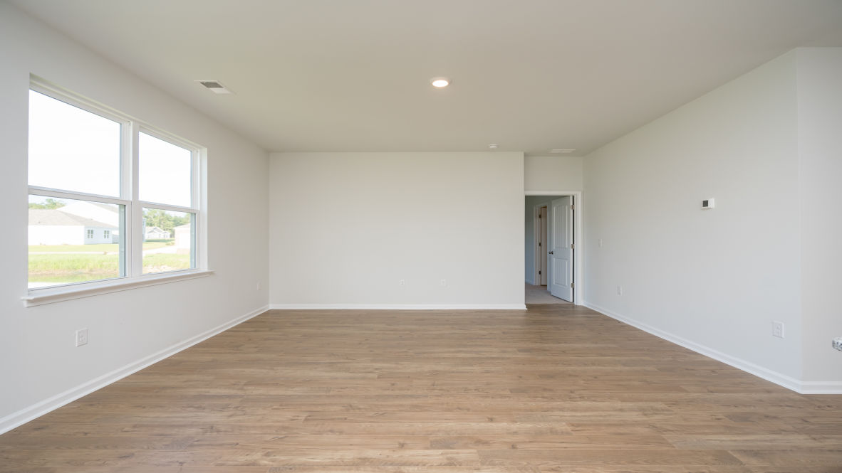 . Its open-concept design includes a kitchen with Granite countertops, Stainless Steel Appliances, an island, and a walk-in pantry, while the large Great Room is ideal for entertaining.