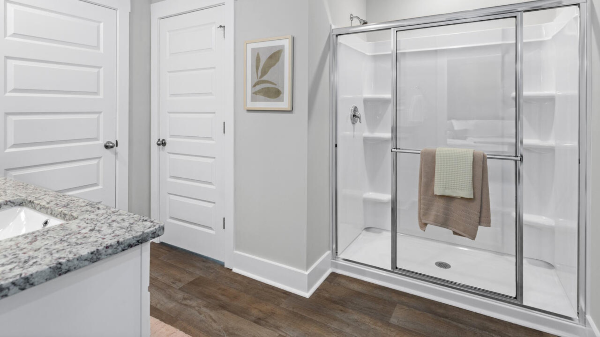 The upstairs has an additional living space, a laundry room, and a Primary Bedroom.