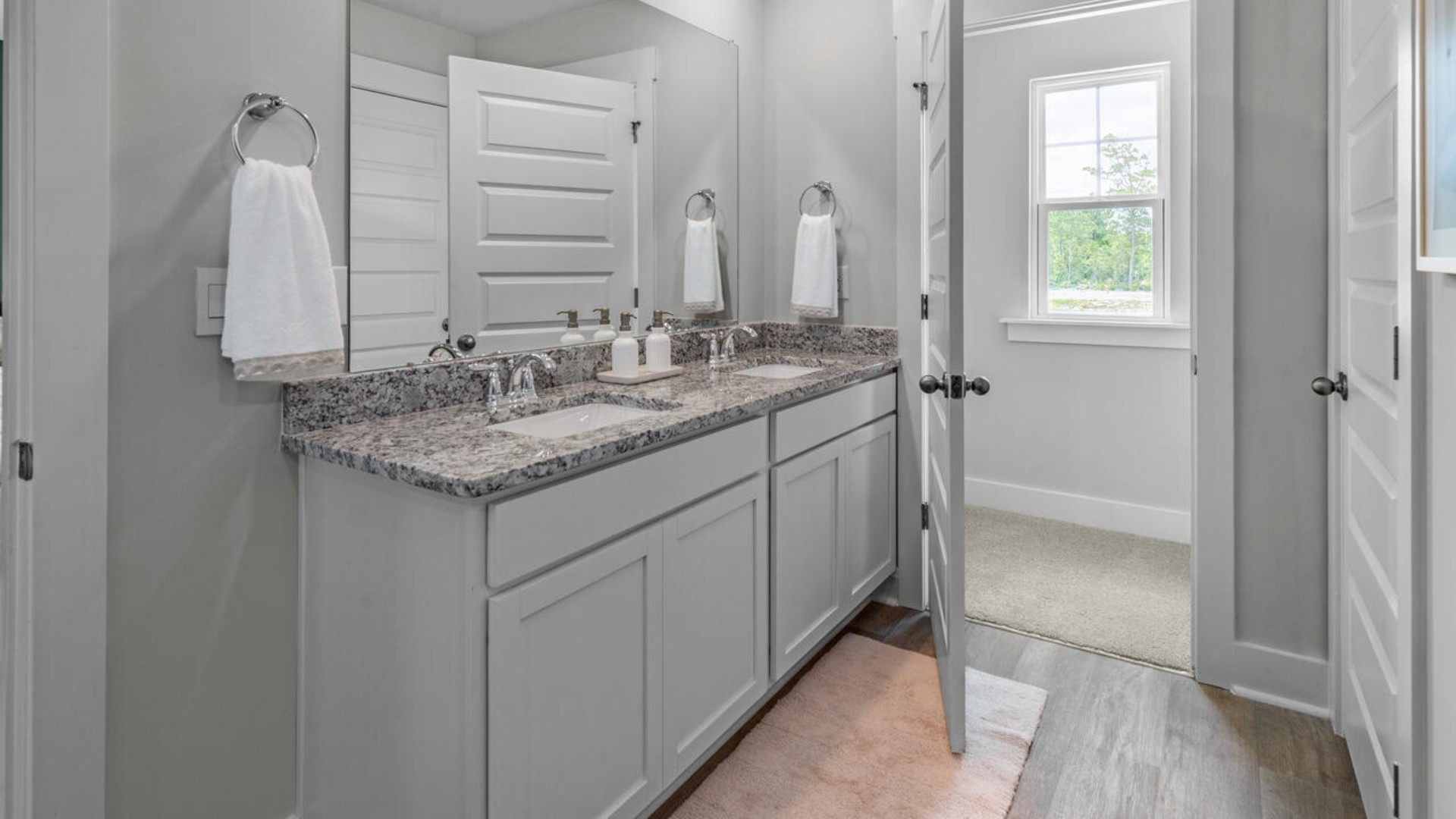 The upstairs has an additional living space, a laundry room, and a Primary Bedroom.