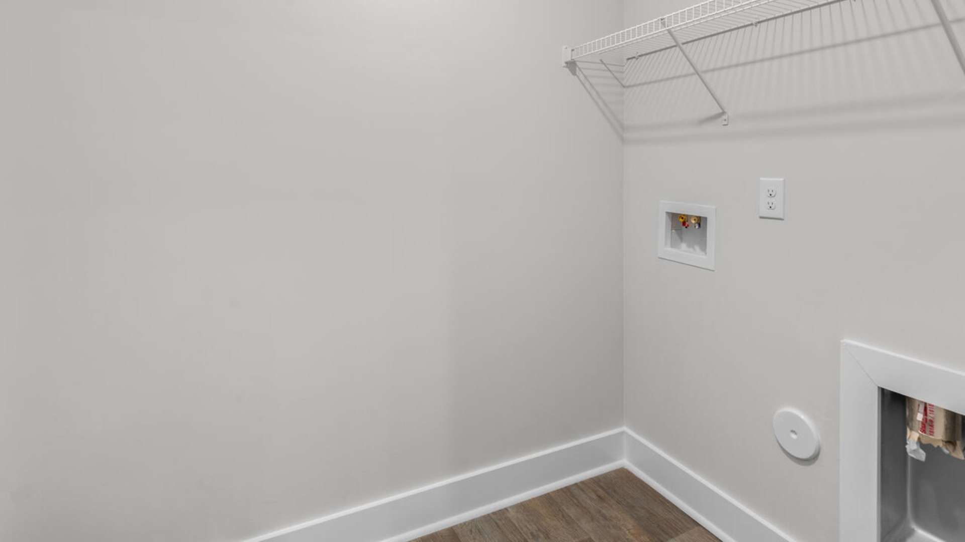 The upstairs has an additional living space, a laundry room, and a Primary Bedroom.