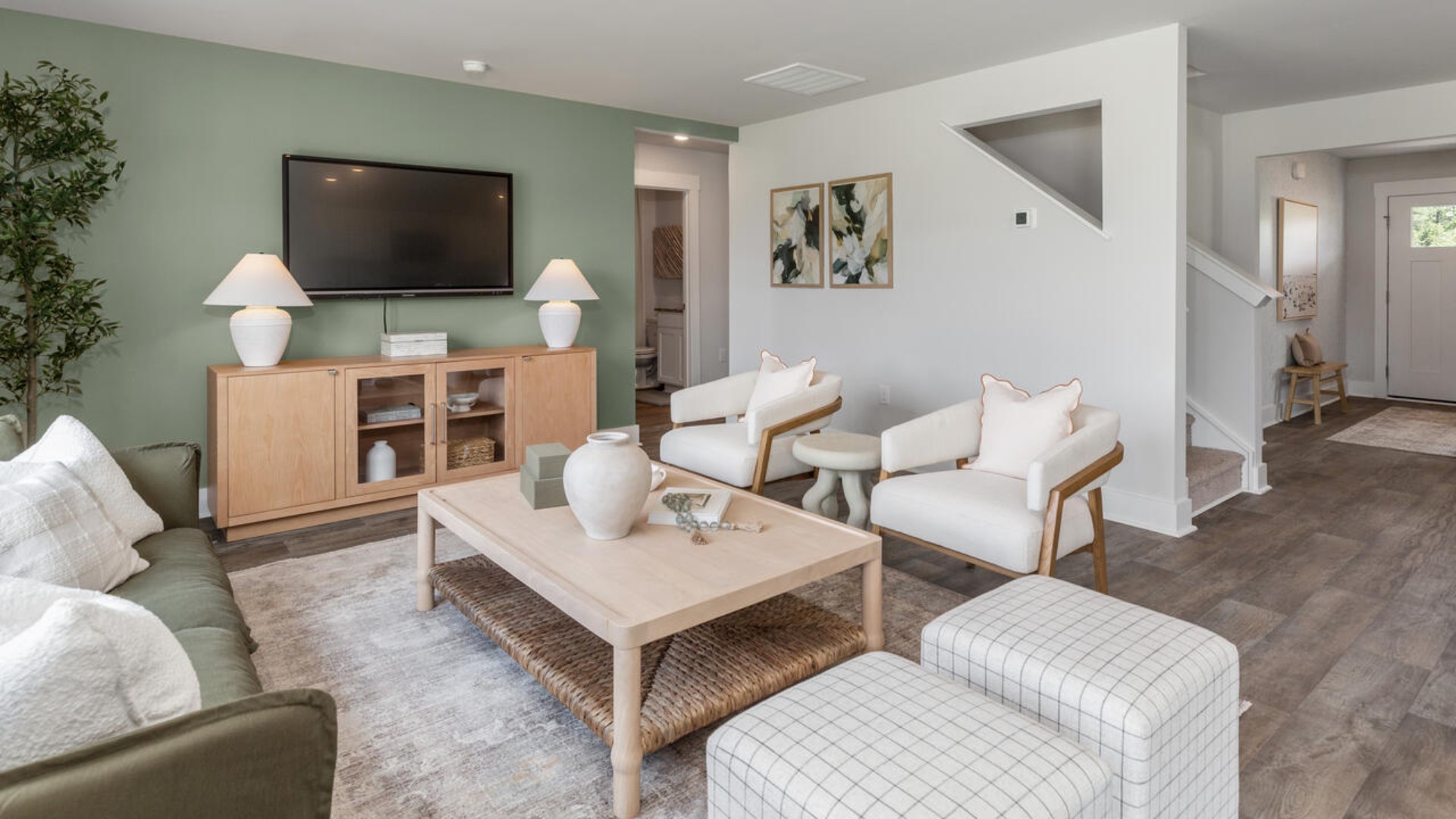 The open-concept kitchen features granite countertops and stainless steel appliances. The kitchen seamlessly connects to the dining and living areas, creating a great space for entertainment.