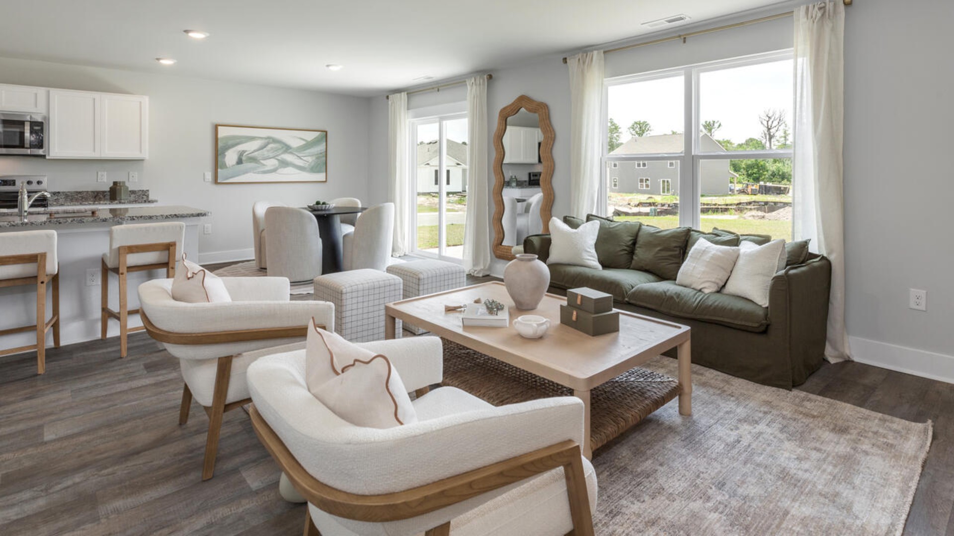 The open-concept kitchen features granite countertops and stainless steel appliances. The kitchen seamlessly connects to the dining and living areas, creating a great space for entertainment.