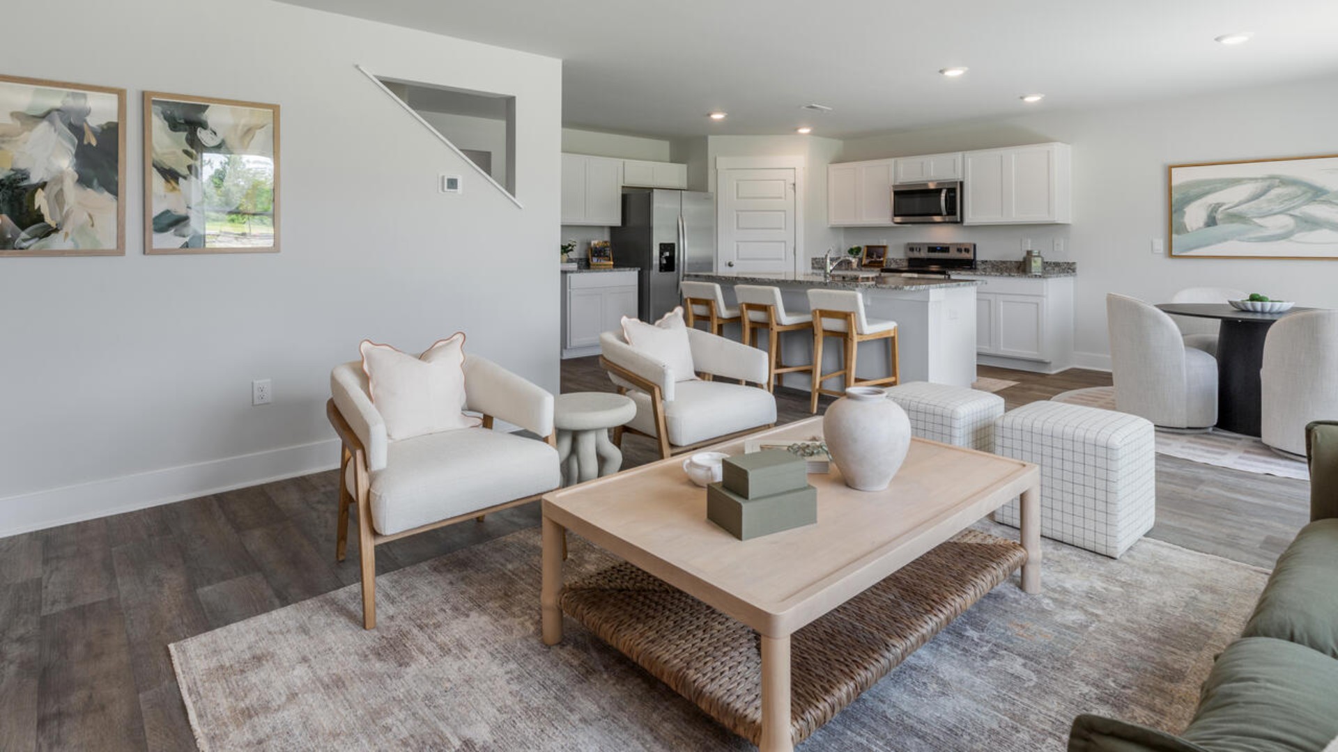 The open-concept kitchen features granite countertops and stainless steel appliances. The kitchen seamlessly connects to the dining and living areas, creating a great space for entertainment.