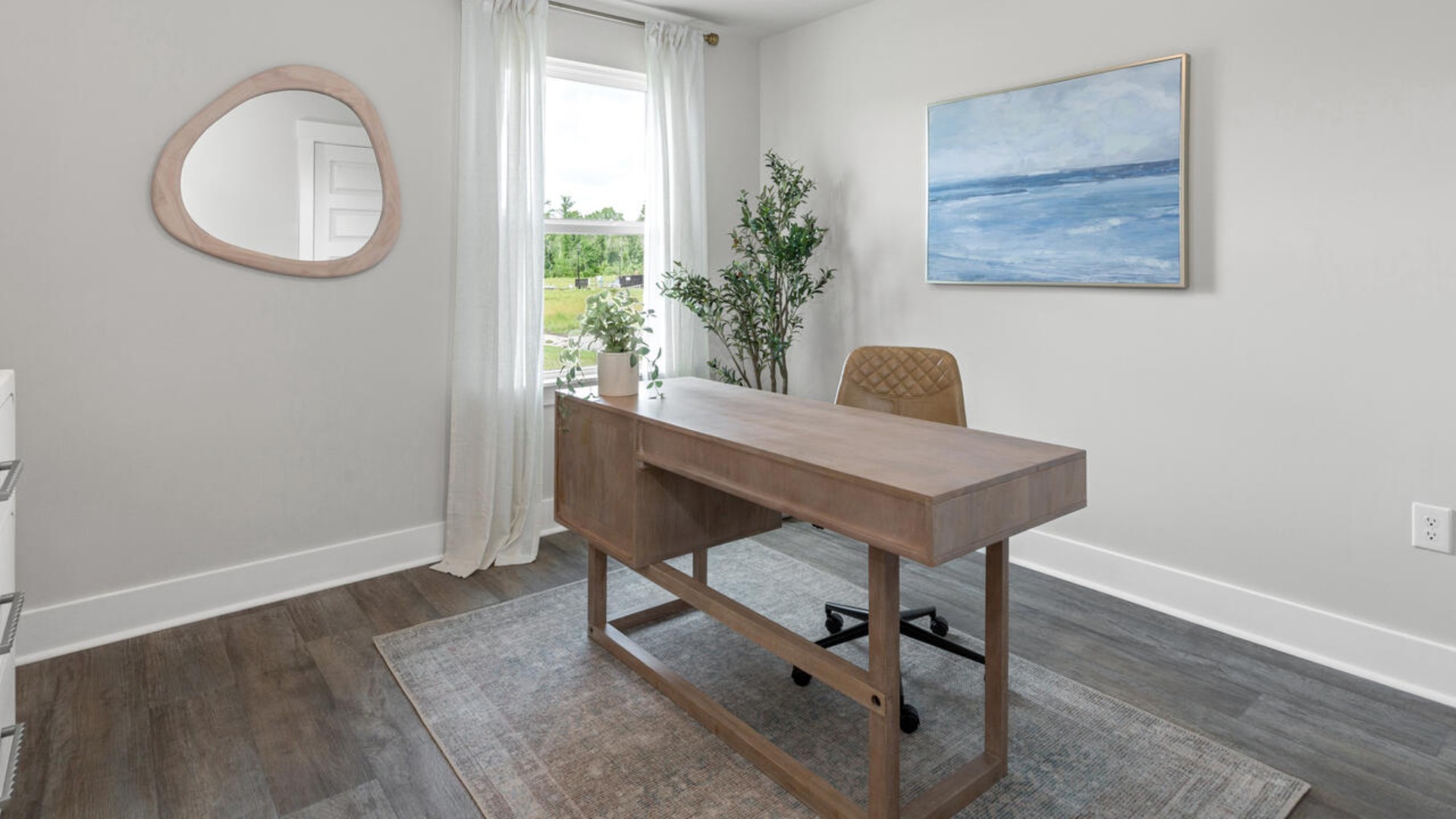 The open-concept kitchen features granite countertops and stainless steel appliances. The kitchen seamlessly connects to the dining and living areas, creating a great space for entertainment.