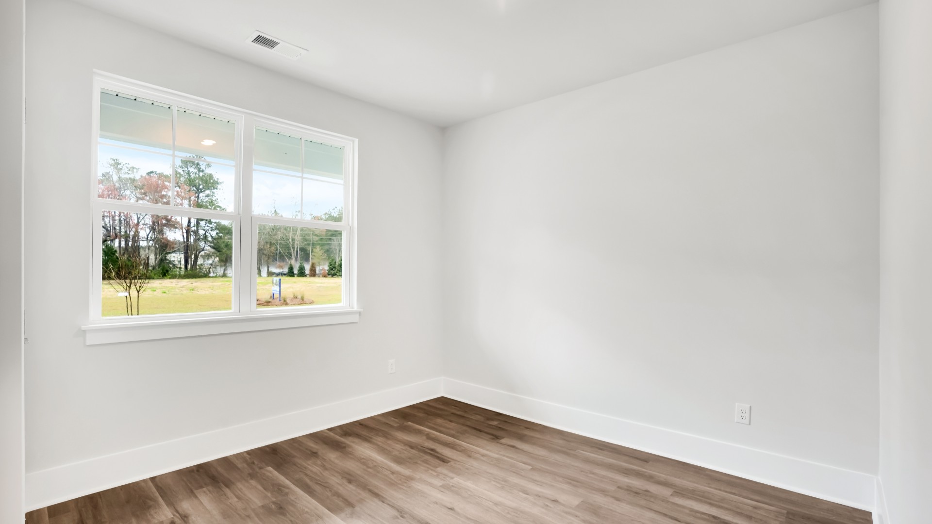 The primary suite serves as a peaceful retreat, featuring an en-suite bathroom with dual vanities and a walk-in closet.