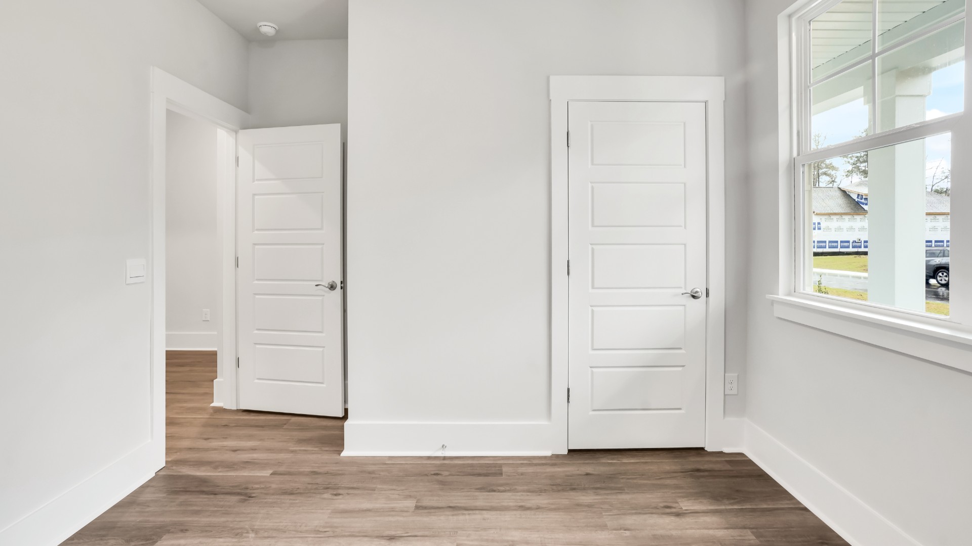 The primary suite serves as a peaceful retreat, featuring an en-suite bathroom with dual vanities and a walk-in closet.