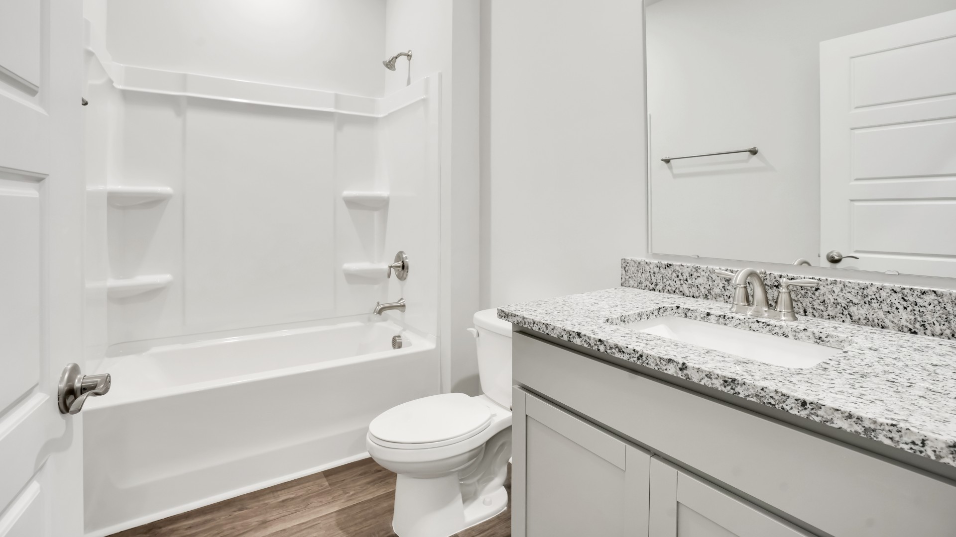The primary suite serves as a peaceful retreat, featuring an en-suite bathroom with dual vanities and a walk-in closet.