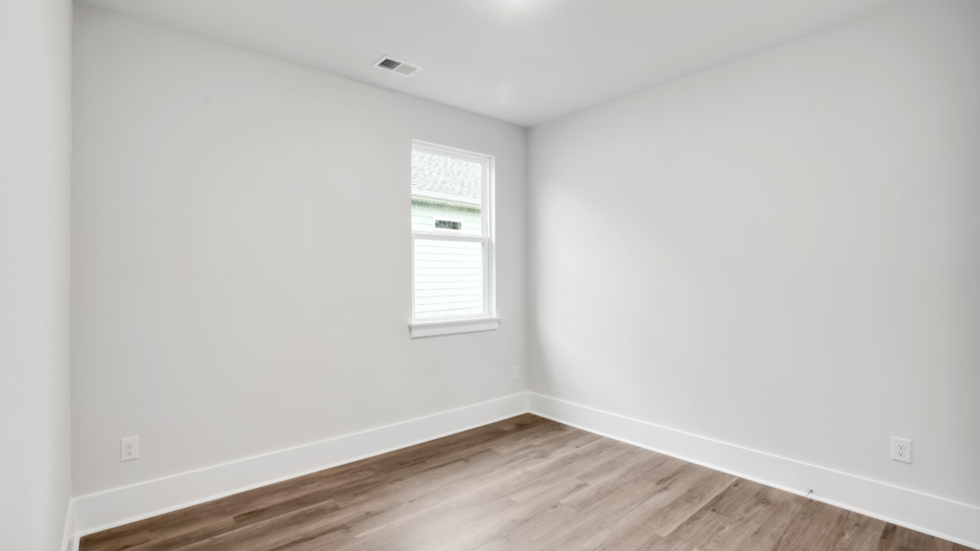 The primary suite serves as a peaceful retreat, featuring an en-suite bathroom with dual vanities and a walk-in closet.