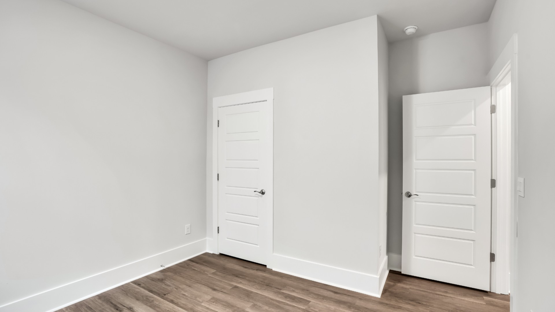 The primary suite serves as a peaceful retreat, featuring an en-suite bathroom with dual vanities and a walk-in closet.