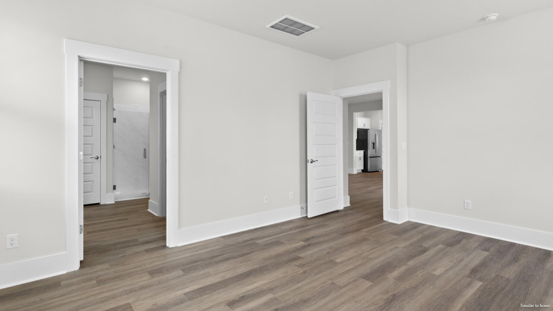 he primary suite features a step-in 5-foot shower and dual vanity