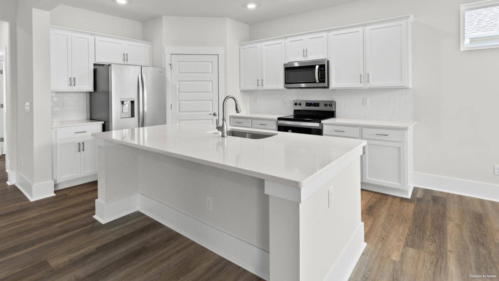 kitchen that features a walk-in pantry, and stainless-steel appliances!
