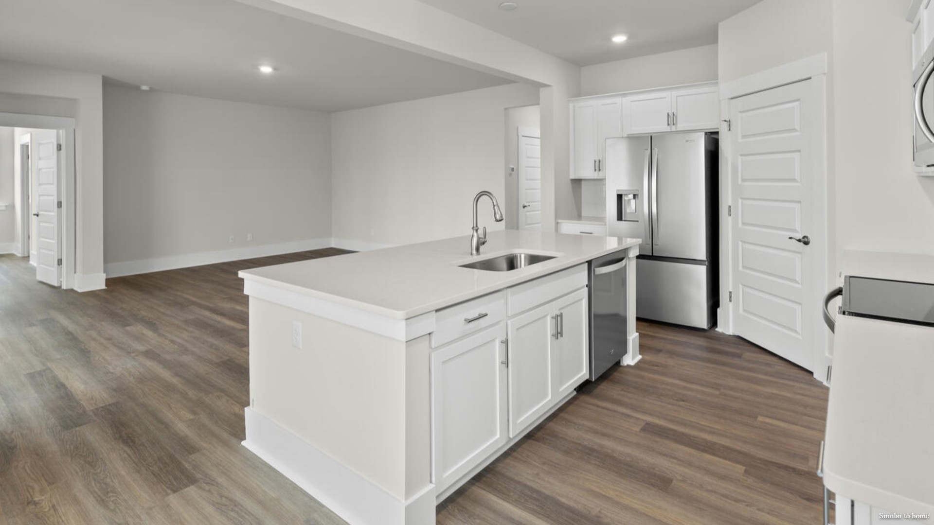 kitchen that features a walk-in pantry, and stainless-steel appliances!