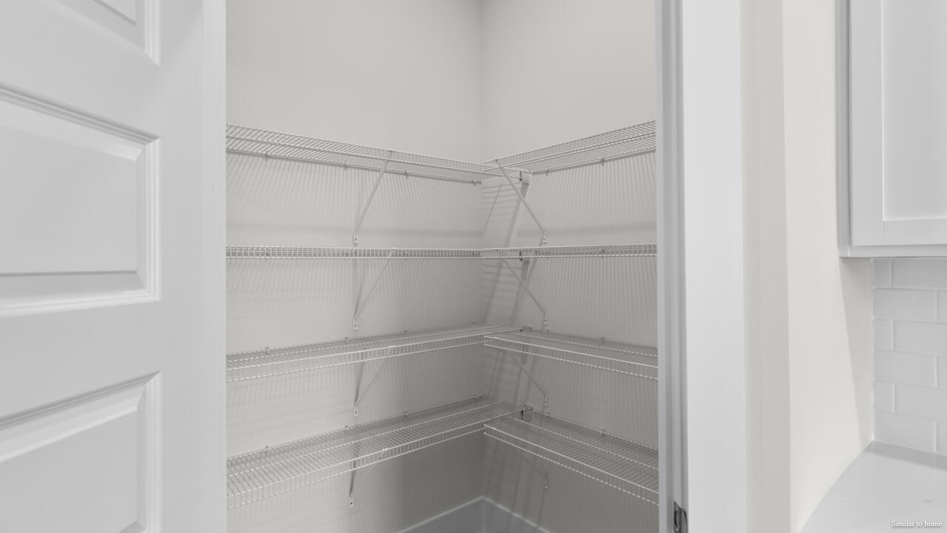 kitchen that features a walk-in pantry, and stainless-steel appliances!