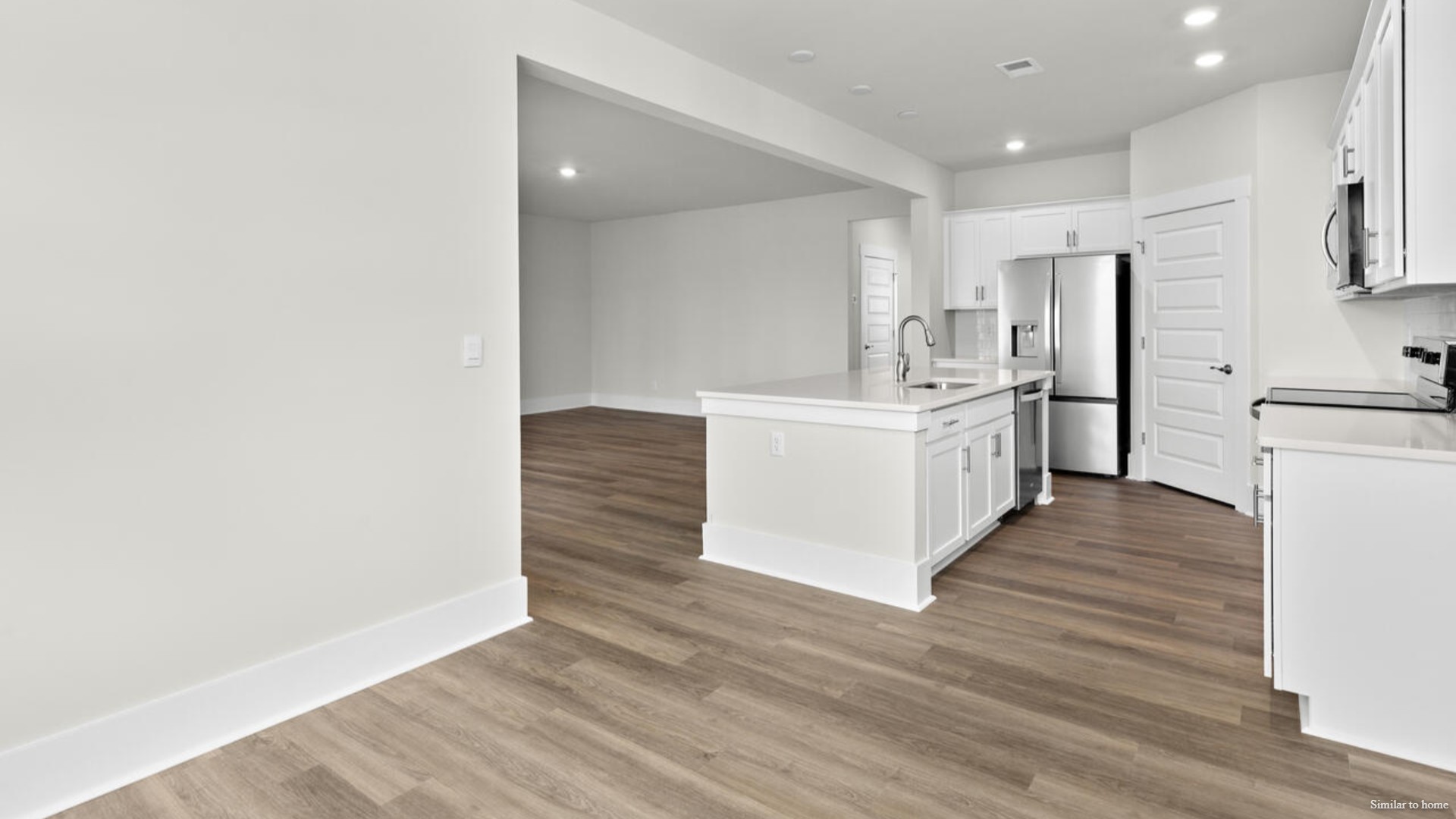The screened-in patio sits right off of the main dining area and kitchen that features a walk-in pantry, and stainless-steel appliances! Luxury vinyl plank flooring is included throughout the home to handle all your beach days year-round.