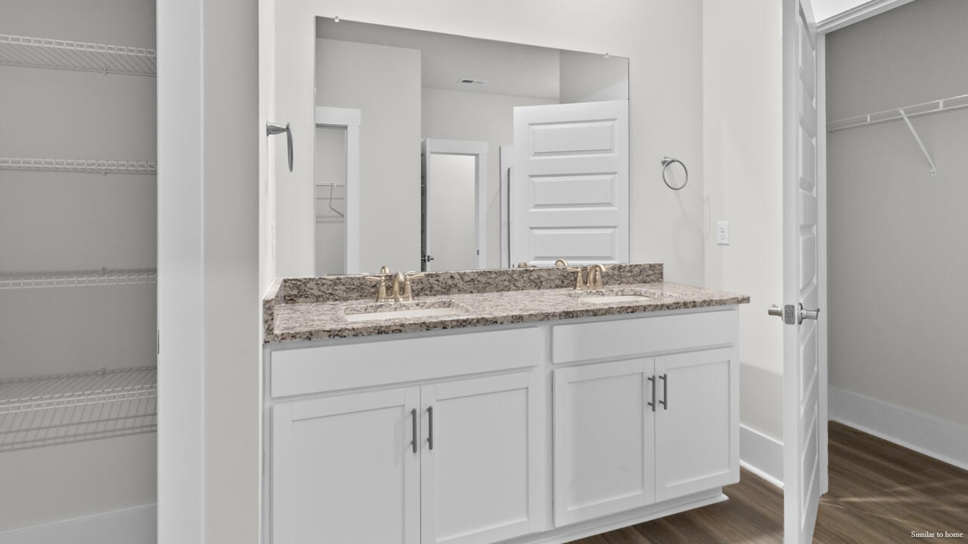 The primary suite features a step-in 5-foot shower and dual vanity