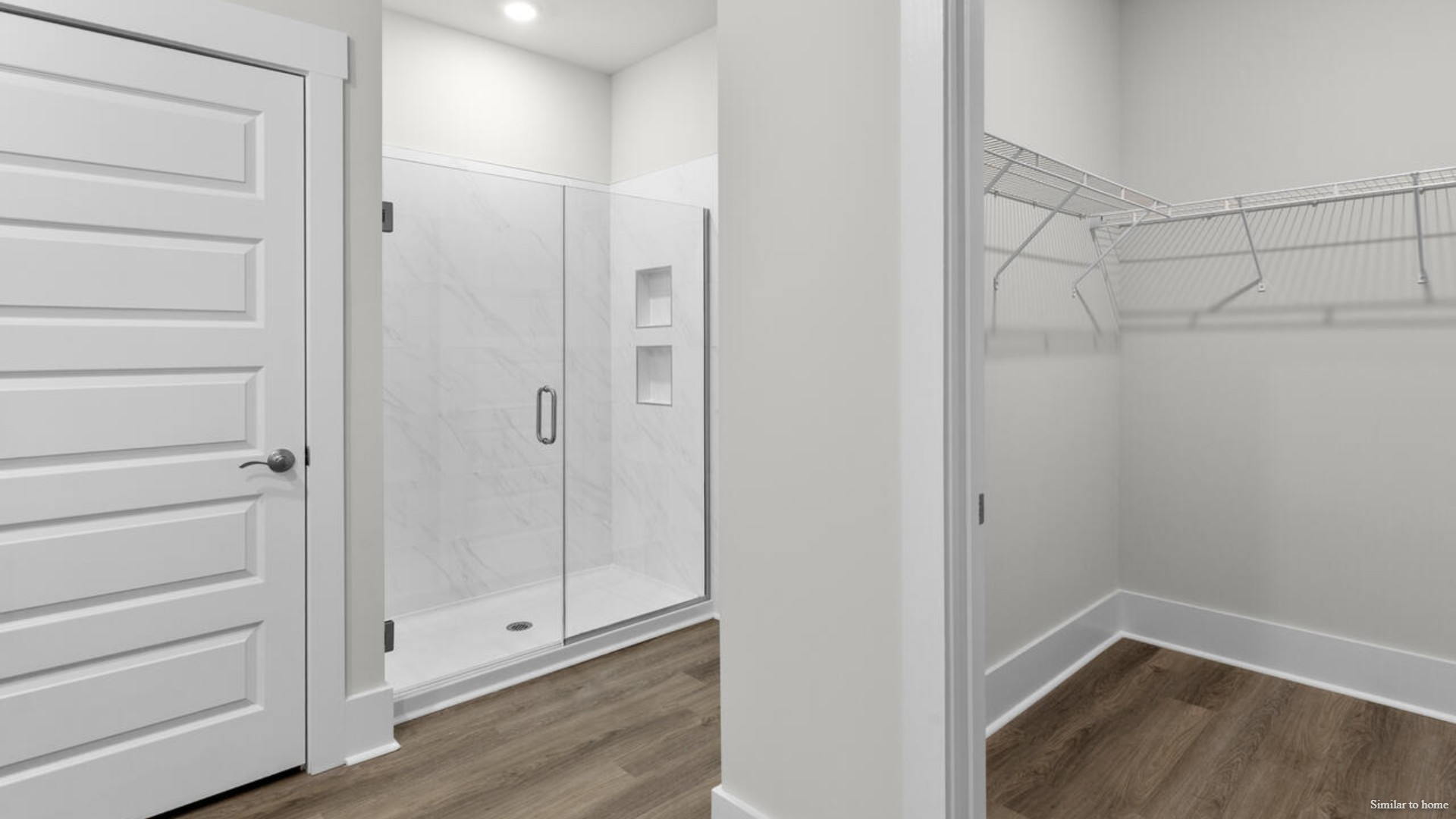 The primary suite features a step-in 5-foot shower and dual vanity