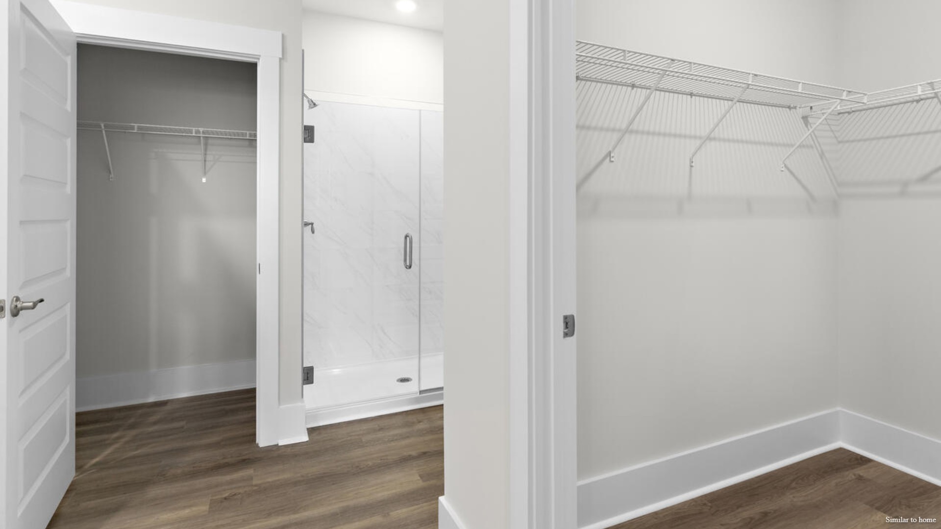 The primary suite features a step-in 5-foot shower and dual vanity