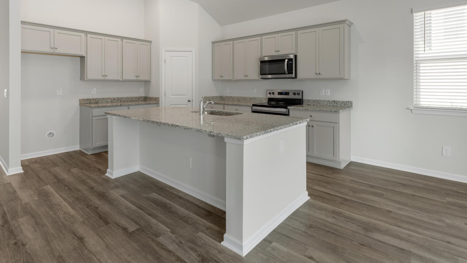 The kitchen features shaker-style cabinets, granite countertops, and stainless-steel appliances, walk-in pantry, which are sure to both turn heads and make meal prep easy.