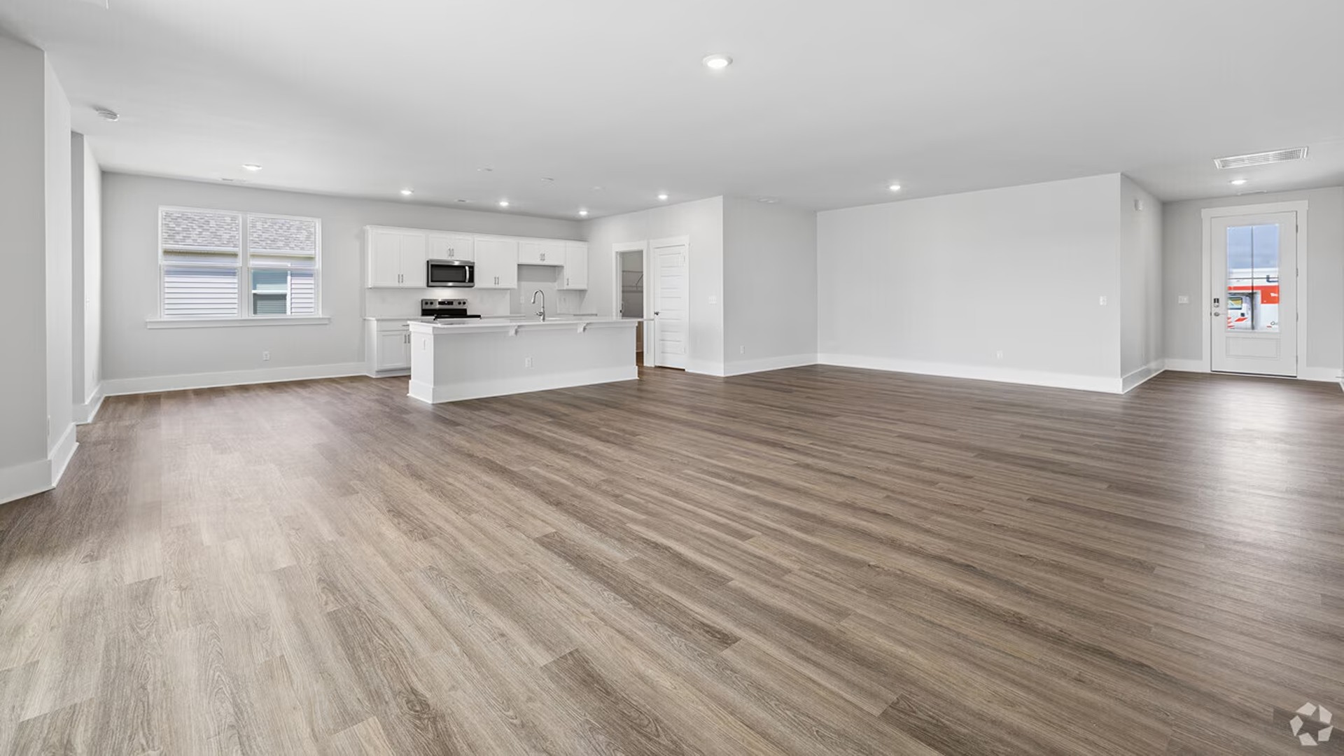 Step inside to discover the expansive, open-concept layout centered around a massive Great Room, ideal for entertaining and family gatherings.