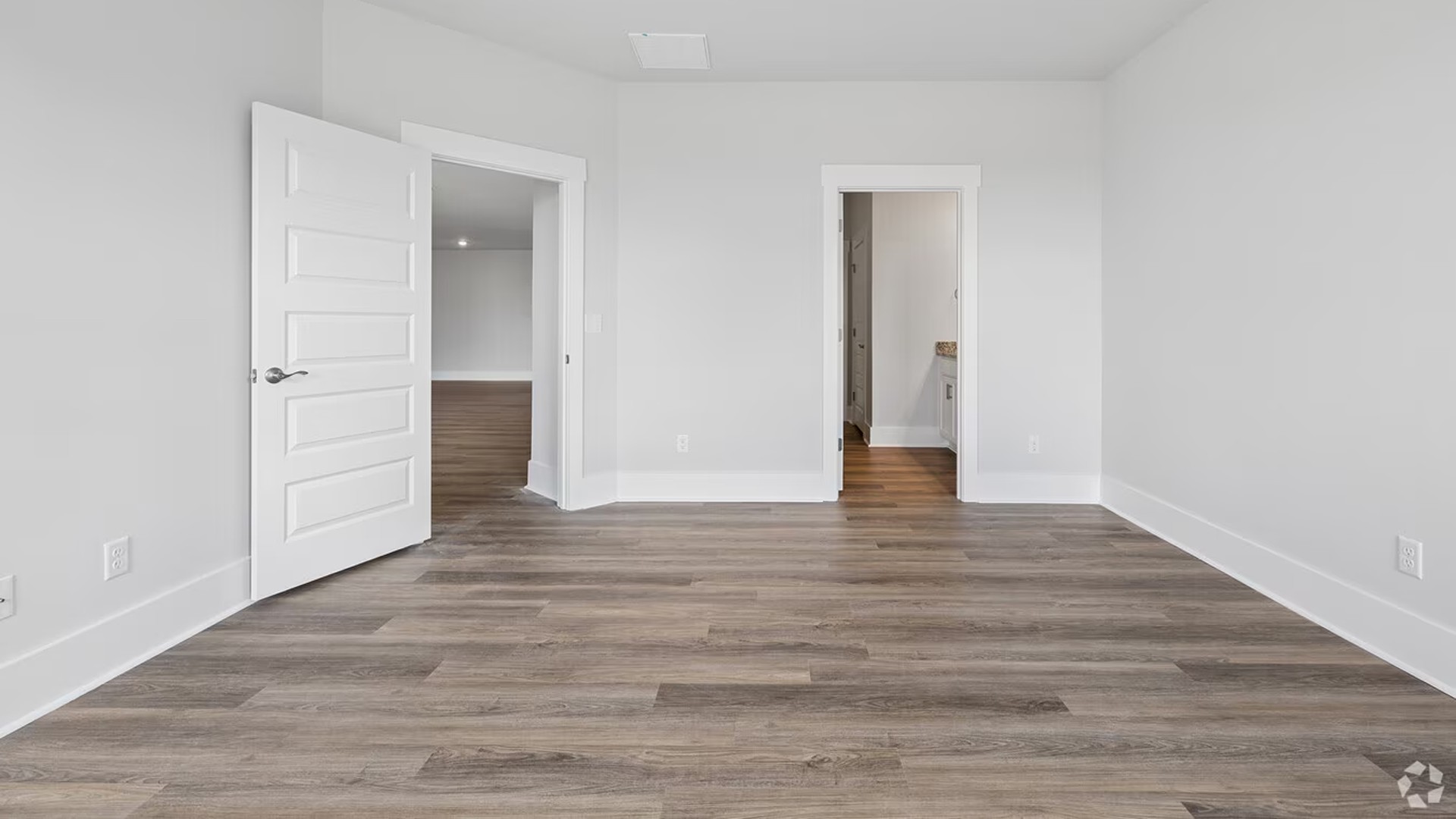 The floor plan is intelligently designed with a split-bedroom layout for ultimate privacy. The spacious Primary Suite is a true retreat, complete with a private en-suite bathroom and a generously sized Walk-in Closet.