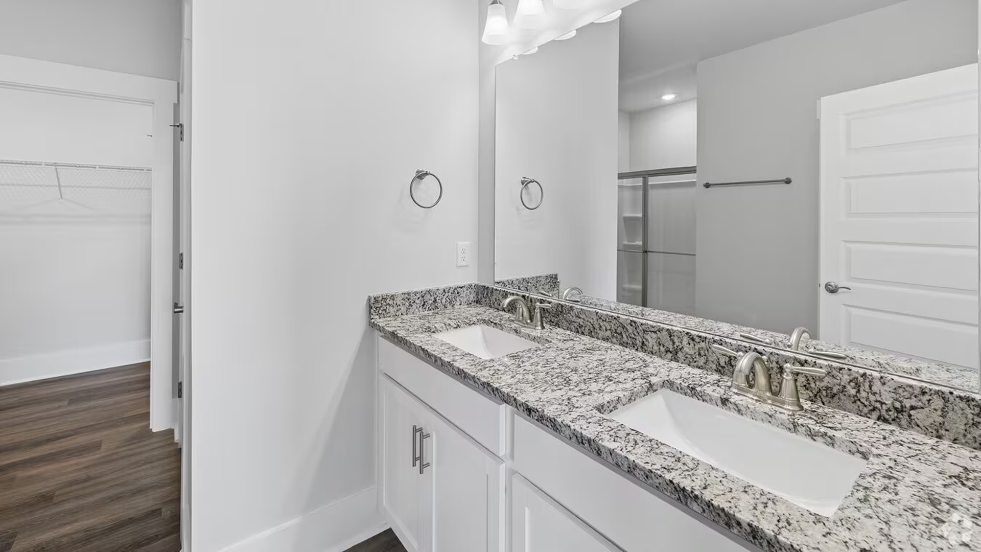 The floor plan is intelligently designed with a split-bedroom layout for ultimate privacy. The spacious Primary Suite is a true retreat, complete with a private en-suite bathroom and a generously sized Walk-in Closet.