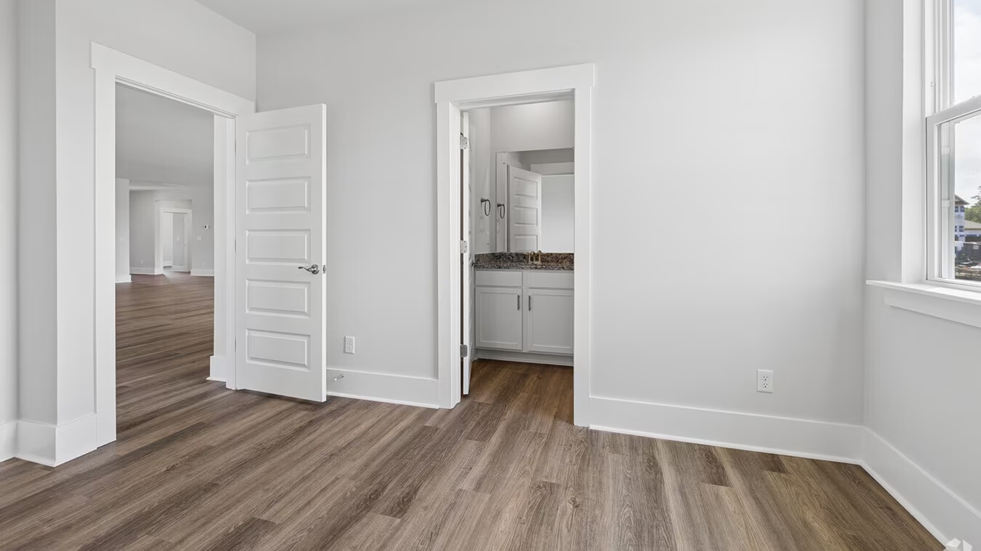 The floor plan is intelligently designed with a split-bedroom layout for ultimate privacy. The spacious Primary Suite is a true retreat, complete with a private en-suite bathroom and a generously sized Walk-in Closet.