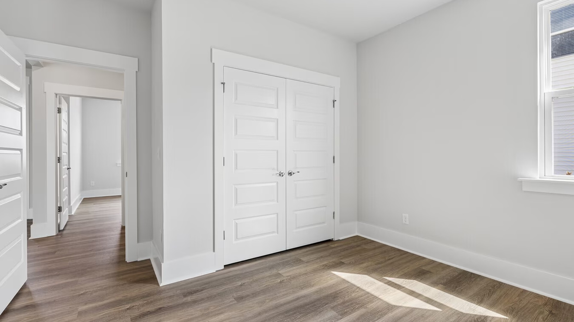 Three additional secondary bedrooms and two full bathrooms are thoughtfully arranged throughout the home, offering fantastic flexibility for guests,