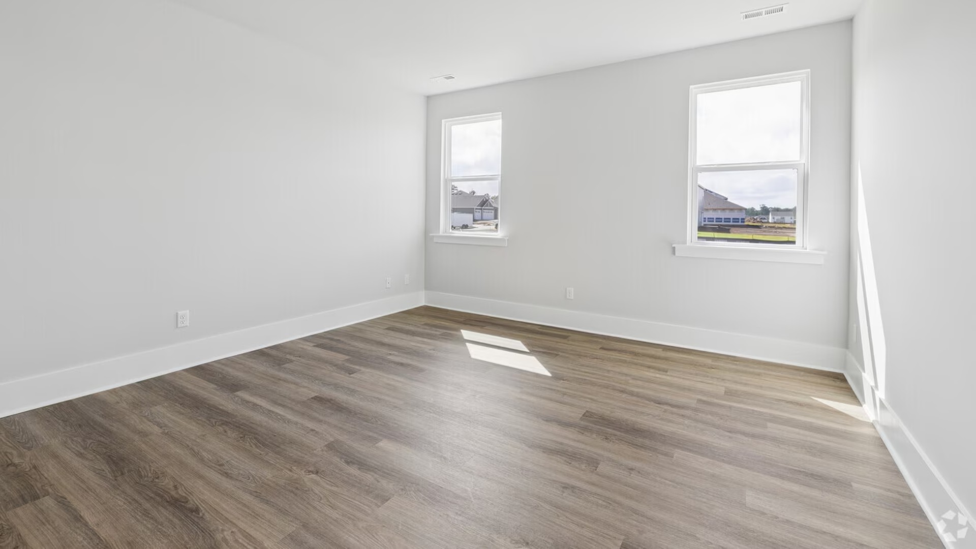 The floor plan is intelligently designed with a split-bedroom layout for ultimate privacy. The spacious Primary Suite is a true retreat, complete with a private en-suite bathroom and a generously sized Walk-in Closet.