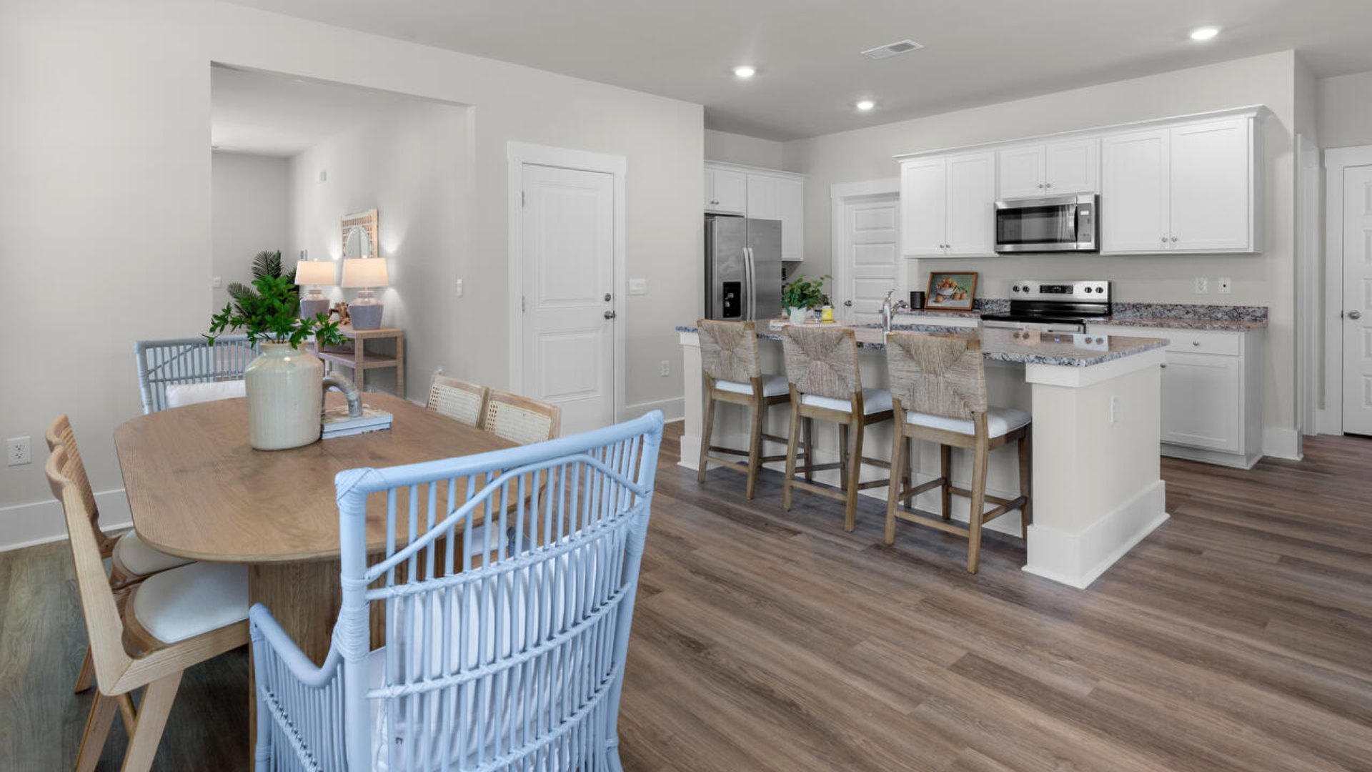 The flexible first floor includes a versatile guest room, office or playroom as well as a full bath across the hall!