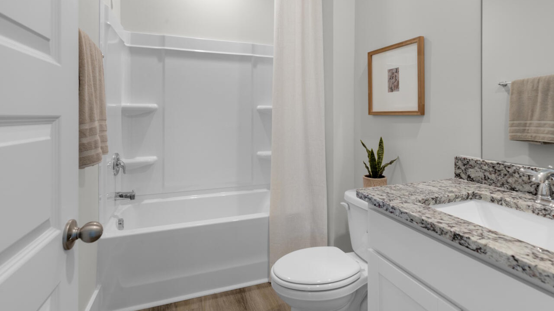 The flexible first floor includes a versatile guest room, office or playroom as well as a full bath across the hall!