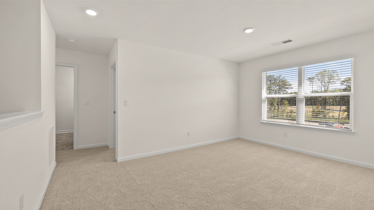 Upstairs there is a generous primary suite with adjoining bath that offers a garden tub, separate shower, dual vanities and plenty of closet space.