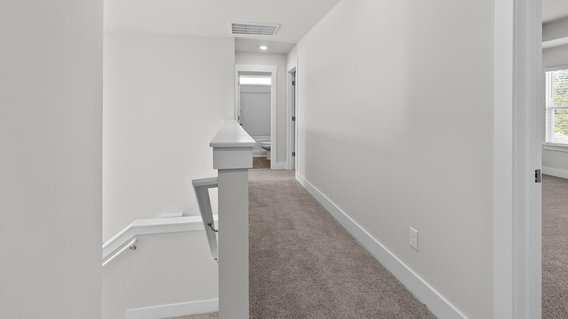 The primary suite features a sitting room, walk-in closet, a step-in 5-foot shower, dual vanity with granite countertops, and natural light in the bathroom