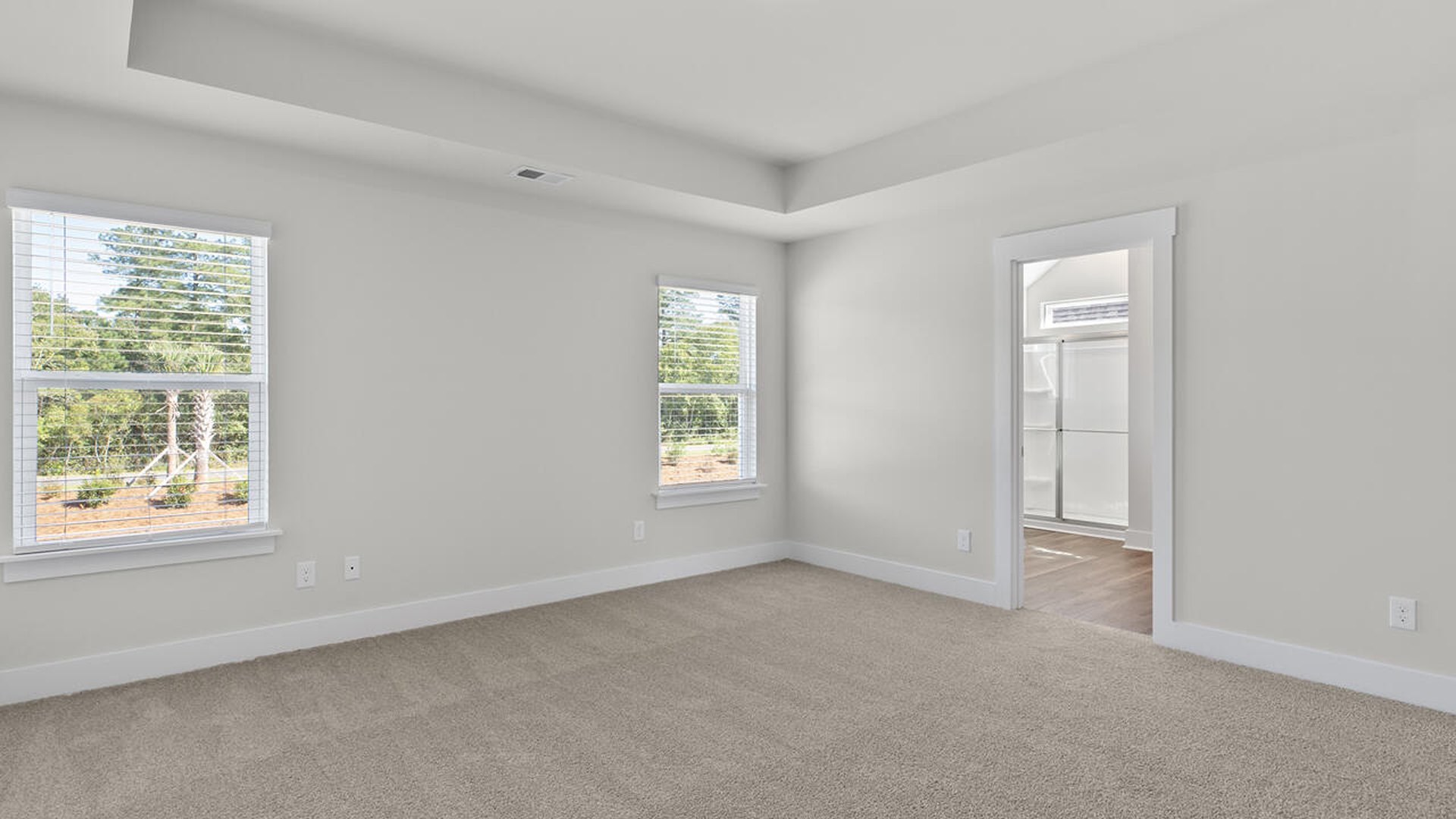 The primary suite features a sitting room, walk-in closet, a step-in 5-foot shower, dual vanity with granite countertops, and natural light in the bathroom. A large bonus room with closet also makes this home ideal for entertaining or just for extra living space.
